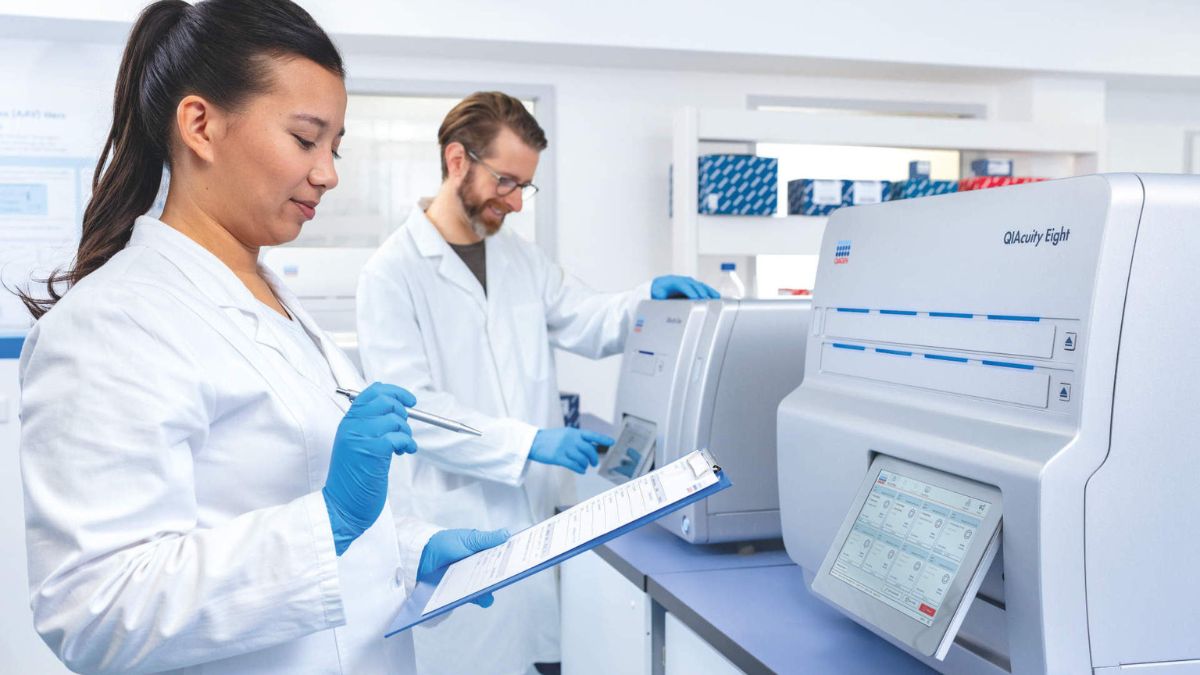 laboratory, two people, woman and man, analyzing data, qiacuity